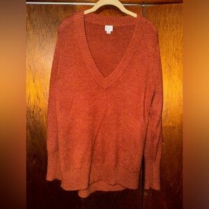 a new day. rust sweater